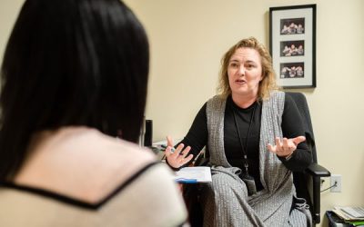 Image of female therapist talking with a patient